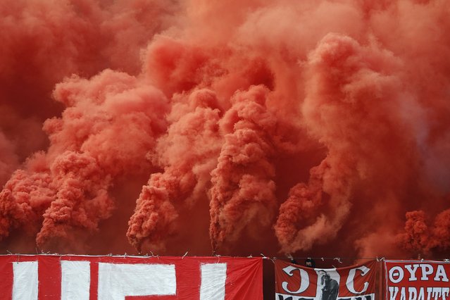 Red Star Belgrade fans cheer amidst smoke during their Serbian Superliga soccer match against Partizan Belgrade in Belgrade, April 25, 2015. (Photo by Marko Djurica/Reuters)