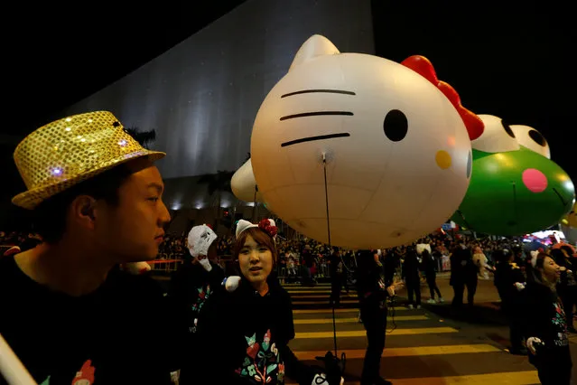 A performer carries a Hello Kitty balloon during a Lunar New Year parade in Hong Kong, China January 28, 2017. (Photo by Bobby Yip/Reuters)