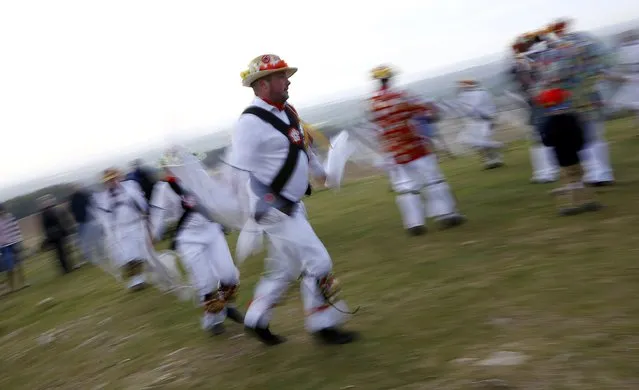 Leicester Morrismen dance during May Day celebrations at Bradgate Park in Newtown Linford, Britain May 1, 2015. (Photo by Darren Staples/Reuters)