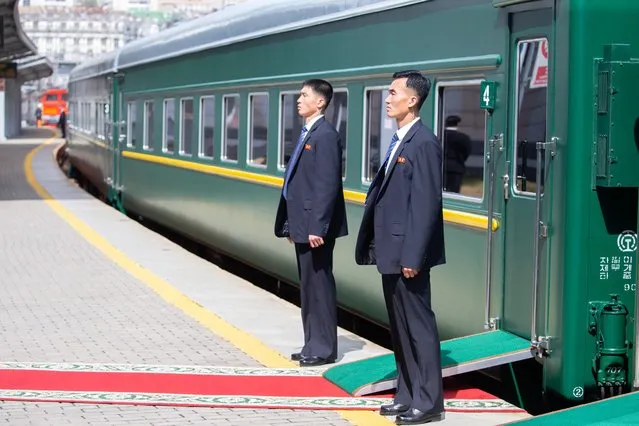 Security personnel stand guard outside a train at a railway station as North Korean leader Kim Jong Un departs from Vladivostok, April 26, 2019. (Photo by Alexander Safronov/Press Service of Administration of Primorsky Krai/Handout via Reuters)