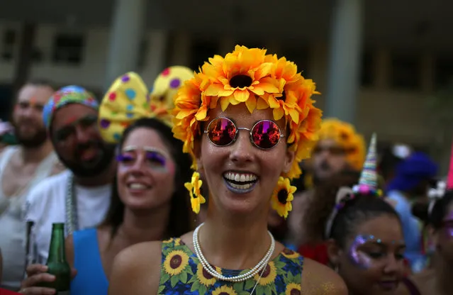 Revellers take part in the annual block party Cordao de Boitata during pre-carnival festivities in Rio Janeiro, Brazil February 19, 2017. (Photo by Pilar Olivares/Reuters)