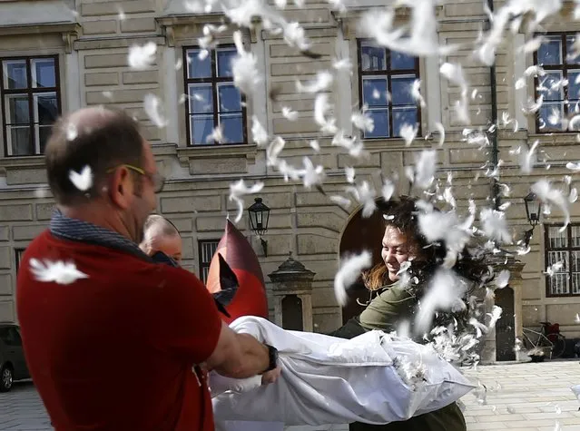 People fight with pillows during World Pillow Fight Day in Vienna, Austria, April 2, 2016. (Photo by Leonhard Foeger/Reuters)