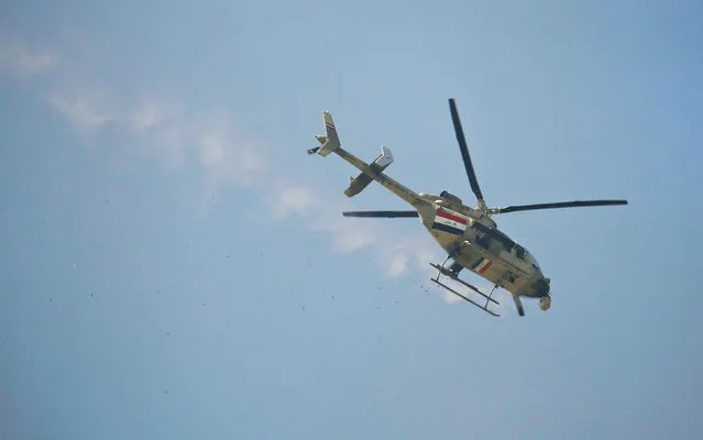 An Iraqi army helicopter fires during a battle with Islamic State's militants south west Mosul, Iraq February 24, 2017. (Photo by Zohra Bensemra/Reuters)