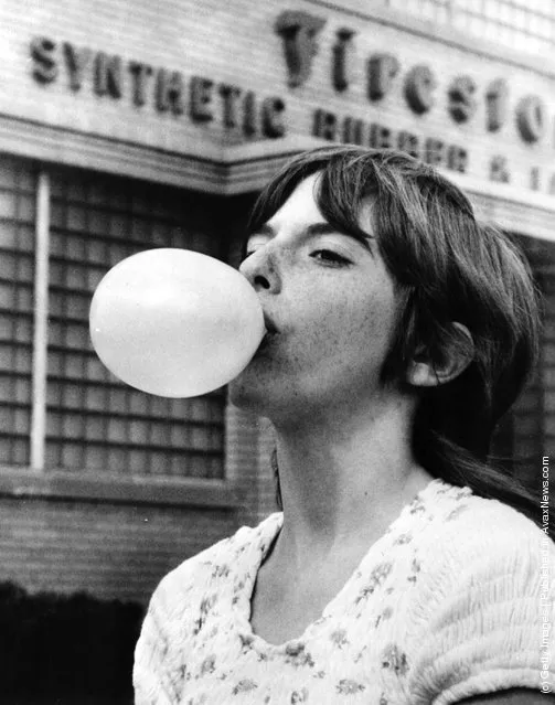 1973: Lisa Cernik, a 13 year old champion bubble gum blower, demonstrates her talent outside the Firestone Rubber Company in Akron, Ohio, where the ingredient for chewing gum is processed