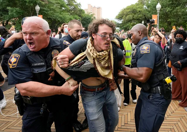 Texas state troopers detain a man at a pro-Palestinian protest at the University of Texas, during the ongoing conflict between Israel and the Palestinian Islamist group Hamas, in Austin, Texas, April 24, 2024. (Photo by Jay Janner/USA Today Network via Reuters)