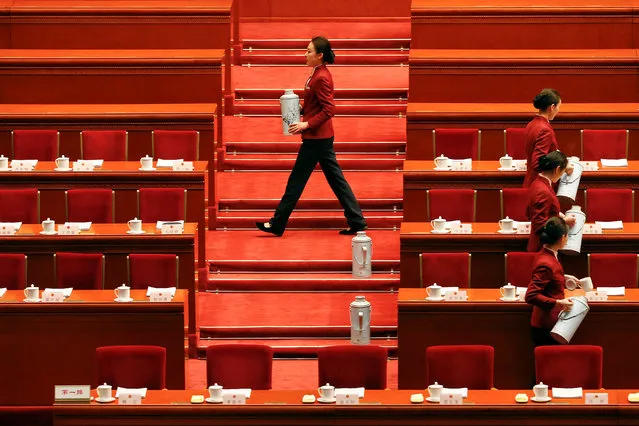 Attendants prepare tea ahead of the third plenary session of the National People's Congress (NPC) in Beijing, China, March 12, 2017. (Photo by Tyrone Siu/Reuters)
