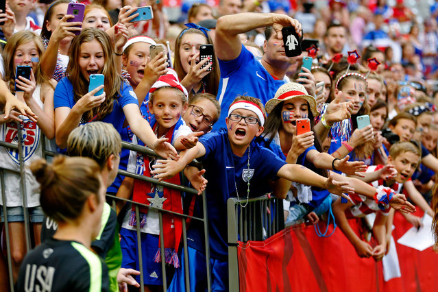 Fans cheer as United States forward Abby Wambach (20) and midfielder Carli Lloyd (10) walk onto the field for warmups before the game against Nigeria in Vancouver, June 16, 2015. (Photo by Michael Chow/USA TODAY Sports)