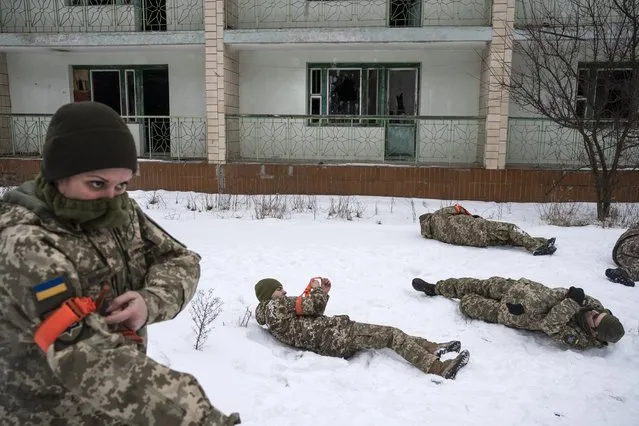 Volunteers and veterans with the Ukrainian Territorial Defense Forces gathered for a training session at an abandoned youth center on February 5, 2022 in the outskirts of Kyiv, Ukraine. (Photo by Michael Robinson Chavez/The Washington Post)