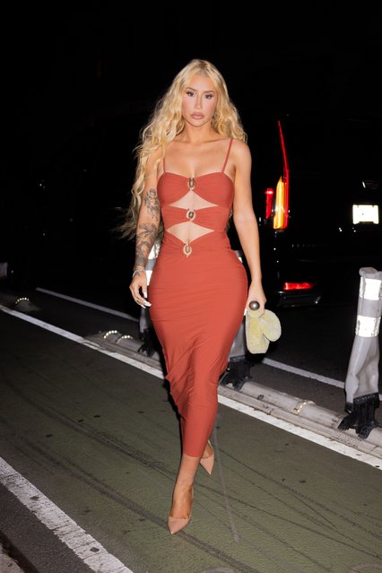 Music sensation Iggy Azalea turns heads in New York City, showcasing her toned abs in a stunning red dress on June 11, 2024. (Photo by WavyPeter/Splash News and Pictures)