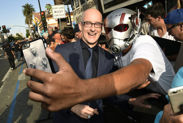 Peyton Reed, director of “Ant-Man”, poses for a selfie with a crowd member at the premiere of the film at The Dolby Theatre on Monday, June 29, 2015, in Los Angeles. (Photo by Chris Pizzello/Invision/AP Photo)