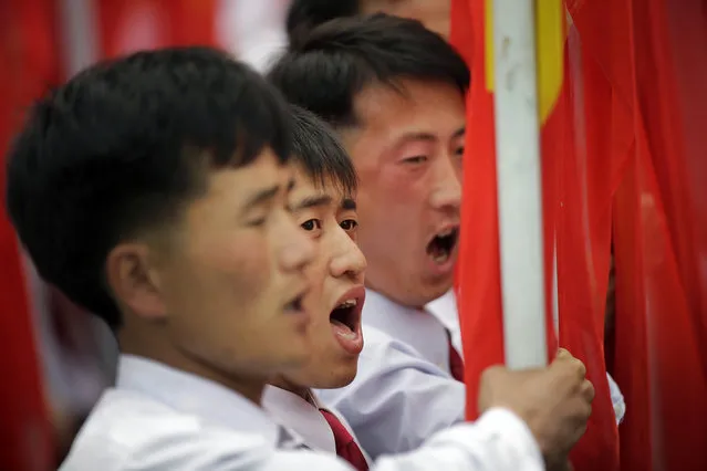 Students from Kim Il Sung University carry the ruling Workers' Party flag as they march during a parade at the Kim Il Sung Square on Tuesday, May 10, 2016, in Pyongyang, North Korea. (Photo by Wong Maye-E/AP Photo)