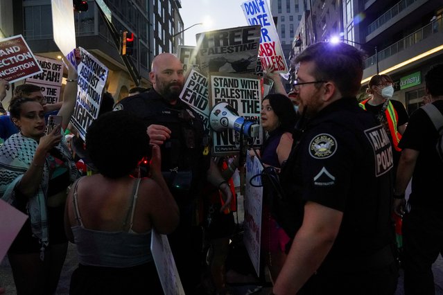 Police officers step in to move anti-abortion activists and Pro-Palestinian protesters out of the street during a rally on the day of the first 2024 presidential debate between President Joe Biden and former President Donald Trump in Atlanta, Georgia on June 27, 2024. (Photo by Megan Varner/Reuters)