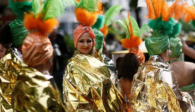 Dancers await the start of the Karneval der Kulturen (Carnival of Cultures) street parade of ethnic minorities in Berlin, Germany, May 15, 2016. (Photo by Hannibal Hanschke/Reuters)