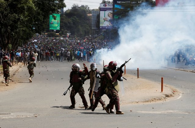 Police stand during a demonstration against Kenya's proposed finance bill 2024/2025 in Nairobi, Kenya, on June 25, 2024. (Photo by Monicah Mwangi/Reuters)