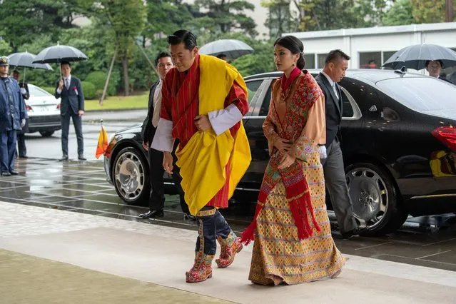 Bhutan's King Jigme Khesar Namgyel Wangchuck and Queen Jetsun Pema arrive for the enthronement ceremony of Japan's Emperor Naruhito at the Imperial Palace in Tokyo, Japan on October 22, 2019. (Photo by Carl Court/Pool via Reuters)