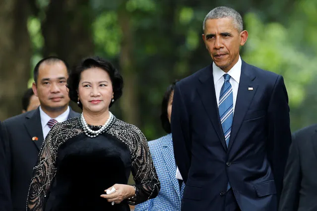 U.S. President Barack Obama walks with Vietnam's National Assembly Chairwoman Nguyen Thi Kim Ngan during a visit at the gardens of the presidential palace in Hanoi, Vietnam May 23, 2016. (Photo by Carlos Barria/Reuters)