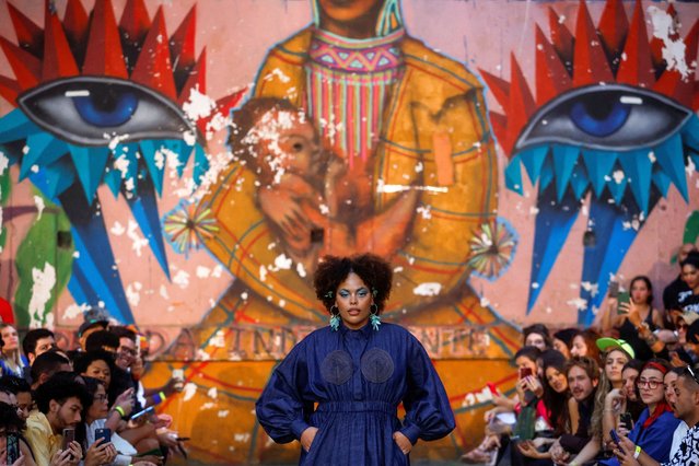 A model presents a creation by designer Isaac Silva on a runway set up at the 9 de Julho building occupied by the homeless movement MSTC during Sao Paulo Fashion Week, in Sao Paulo, Brazil on May 24, 2023. (Photo by Amanda Perobelli/Reuters)