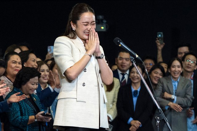 Thailand's new Prime Minister Paetongtarn Shinawatra, known by her nickname “Ung Ing” and daughter of former prime minister Thaksin Shinawatra, reacts during a press conference in Bangkok on August 16, 2024. Thai lawmakers on August 16 appointed the 37-year-old daughter of billionaire Thaksin Shinawatra as prime minister, elevating a third member of the influential but divisive clan to the nation's top job. (Photo by Chanakarn Laosarakham/AFP Photo)