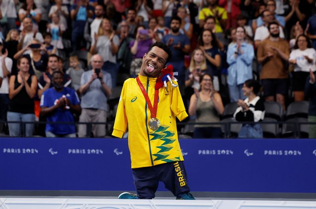 Gold medallist Gabriel Geraldo dos Santos Araujo Gabriel Geraldo of Brazil celebrates on the podium with his medal after the men's 50m backstroke S2 final in Nanterre, France on August 31, 2024. (Photo by Andrew Couldridge/Reuters)