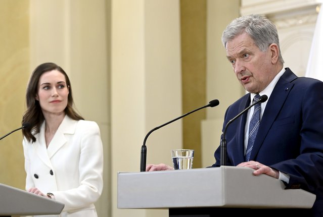 Finland's President Sauli Niinisto and Prime Minister Sanna Marin, left, attend the press conference on Finland's security policy decisions at the Presidential Palace in Helsinki, Finland, Sunday May 15, 2022. Finland’s president and government have announced that the Nordic country intends to apply for membership in NATO, paving the way for the 30-member Western military alliance to expand amid Russia’s war in Ukraine. (Photo by Heikki Saukkomaa/Lehtiuva via AP Photo)