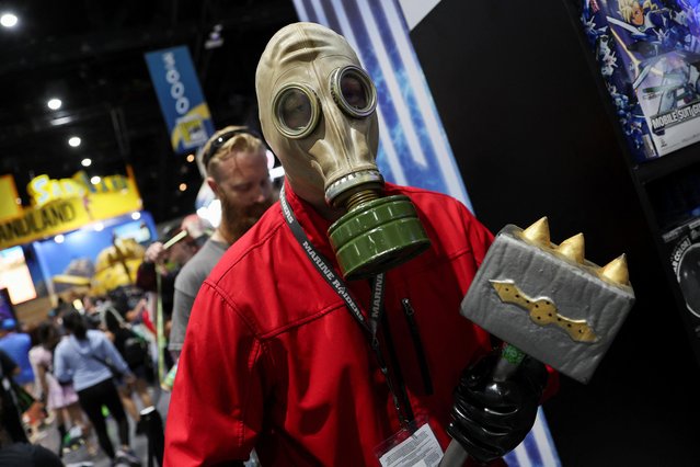 A person wears a costume, as they walk the convention floor, during Comic-Con International in San Diego, California, U.S., July 21, 2023. (Photo by Mike Blake/Reuters)