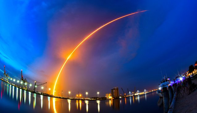 A SpaceX Falcon 9 rocket with a payload of Starlink V2 Mini internet satellites is seen during a time exposure as it lifts off from Launch Complex 40 at the Cape Canaveral Space Force Station in Cape Canaveral, Fla., late Sunday, July 23, 2023. (Photo by John Raoux/AP Photo)