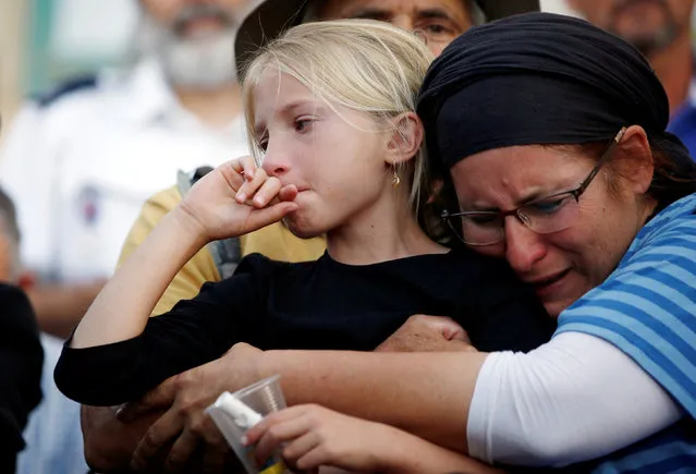 Relatives and friends mourn during the funeral of Israeli girl, Hallel Yaffa Ariel, 13, who was killed in a Palestinian stabbing attack in her home in the West Bank Jewish settlement of Kiryat Arba, at a cemetery in the West Bank city of Hebron June 30, 2016. (Photo by Ronen Zvulun/Reuters)