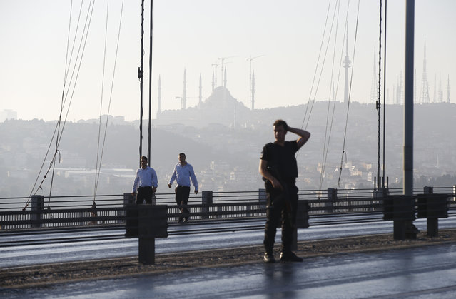 People walk on Istanbul's iconic Bosporus Bridge, Saturday, July 16, 2016. (Photo by Emrah Gurel/AP Photo)