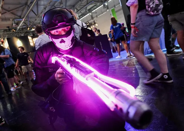 A man poses as a member of the “SCP Foundation” at the Gamescom 2022 in Cologne, Germany August 25, 2022. (Photo by Benjamin Westhoff/Reuters)