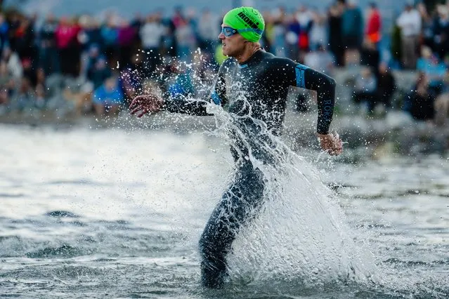 Athletes compete at the start of the swim portion during the IRONMAN Canada on August 28, 2022 in Penticton, British Columbia. (Photo by Jacob Kupferman/Getty Images for IRONMAN)