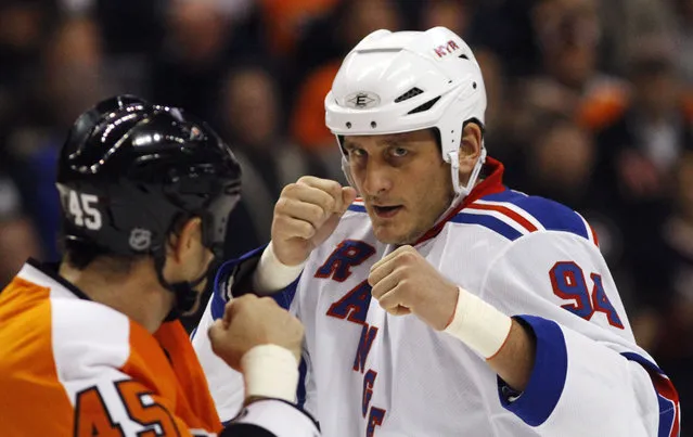 In this November 4, 2010, file photo, Philadelphia Flyers' Jody Shelley, left, and New York Rangers' Derek Boogaard fight during an NHL hockey game in Philadelphia. A former minor league hockey player has been arrested on charges he sold illegally obtained prescription painkillers to former hockey player Derek Boogaard of the Rangers and the Minnesota Wild who died of an accidental overdose. (Photo by Matt Slocum/AP Photo)