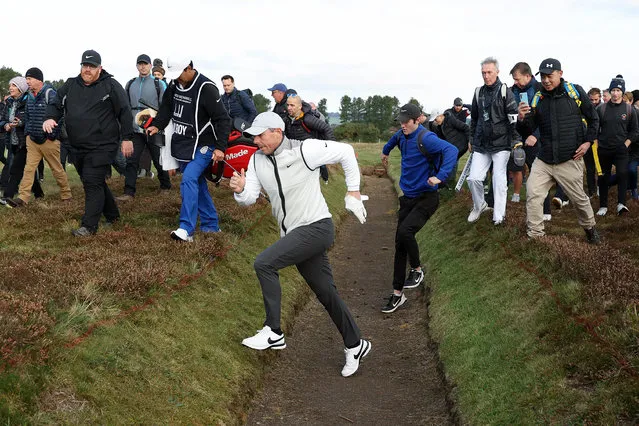 Rory McIlroy of Northern Ireland walks through the trench after playing their second shot on the 12th hole during Day One of the Alfred Dunhill Links Championship at Carnoustie Golf Links on September 29, 2022 in St Andrews, Scotland. (Photo by Richard Heathcote/Getty Images)
