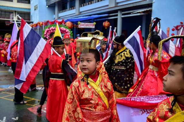 School children take part in a traditional parade to celebrate the upcoming lunar new year in the southern Thai province of Narathiwat on January 25, 2025. (Photo by Madaree Tohlala/AFP Photo)