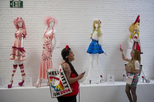 Hello Kitty dresses are on display at the Hello Kitty Con, the first-ever Hello Kitty fan convention, held at the Geffen Contemporary at MOCA Thursday, October 30, 2014, in Los Angeles. (Photo by Jae C. Hong/AP Photo)