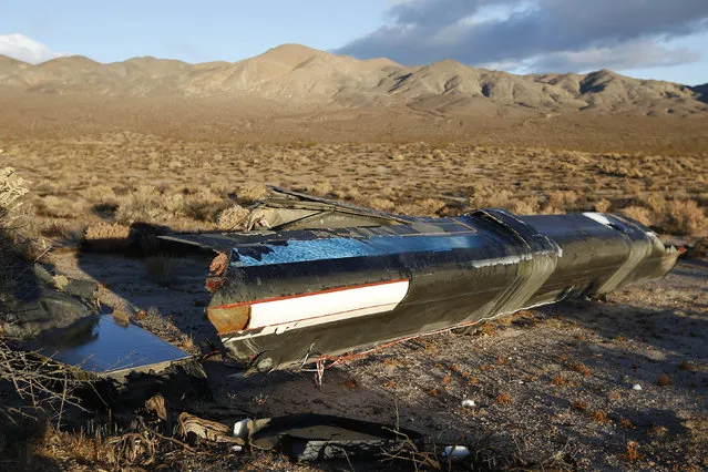 A piece of debris is seen near the crash site of Virgin Galactic's SpaceShipTwo near Cantil, California, on November 2, 2014. (Photo by Lucy Nicholson/Reuters)