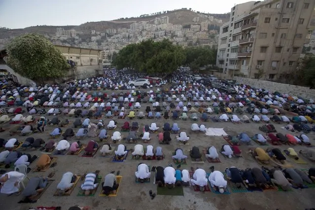 Palestinians Muslims offer Eid al-Adha prayers, in the West Bank city of Nablus, Friday, July 31, 2020. Eid al-Adha, or Feast of Sacrifice, Islam's most important holiday marks the willingness of the Prophet Ibrahim to sacrifice his son. (Photo by Majdi Mohammed/AP Photo)