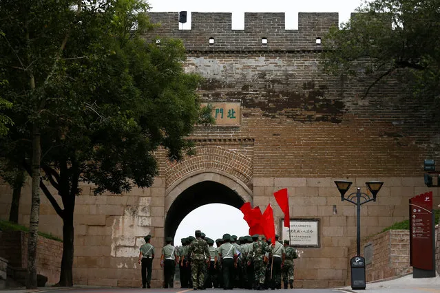 Security personnel walk through an arch underneath a section of the Great Wall before a visit by Canadian Prime Minister Justin Trudeau (not pictured) and his family in Badaling, north of Beijing, China, September 1, 2016. (Photo by Thomas Peter/Reuters)