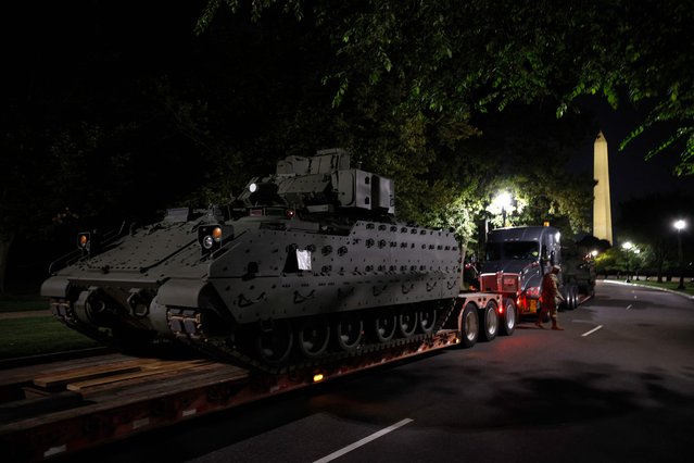 A Bradley Fighting Vehicle waits to be unloaded near the Washington Monument on June 10, 2025 in Washington, DC. Tanks and other heavy military equipment have arrived in the Nation's Capital for a military parade in honor of the U.S. Army's 250th anniversary, which coincides with President Donald Trump's birthday and Flag Day. (Photo by Kevin Dietsch/Getty Images/AFP Photo)