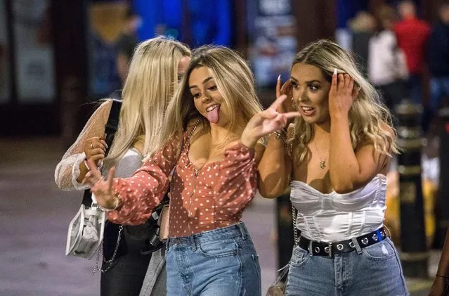 Pals let their hair down for one last hoorah in Cardiff, capital of Wales on September 12, 2020. Groups of friends crammed into pubs and restaurants to “go out in style” before the “rule of six” is enforced on Monday. (Photo by Huw Evans Picture Agency/The Sun)