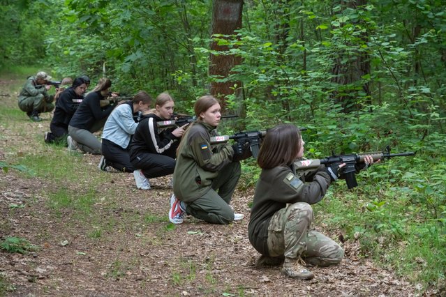 Teenagers aged 16 and over take part in a two-day military-patriotic training in Lviv region, Ukraine, on June 13, 2025. The training was held to mark the 134th anniversary of the birth of OUN-UPA leader Yevhen Konovalets. Organized by veterans of the NGO “Shkval”, the program included sessions on tactical medicine, weapon handling, military formation, forest combat tactics, mine safety, and drone operations. (Photo by Olena Znak/Anadolu via Getty Images)