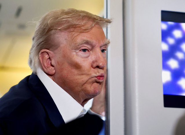 U.S. President Donald Trump reacts as he speaks to members of the media on board Air Force One en route from Scotland, Britain, to Joint Base Andrews, Maryland, U.S., July 29, 2025. (Photo by Evelyn Hockstein/Reuters)