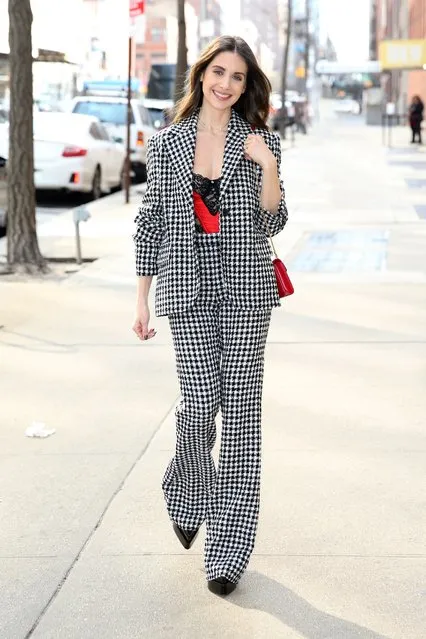 American actress Alison Brie is spotted in a Valentine's Day bustier and herringbone suit in New York City in the first decade of February 2023. (Photo by Christopher Peterson/Splash News and Pictures)
