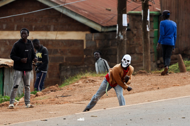 A protester wearing a mask takes part in clashes with police during the “Saba Saba People's March” anti-government protest in Nairobi, Kenya on July 7, 2025. (Photo by Monicah Mwangi/Reuters)