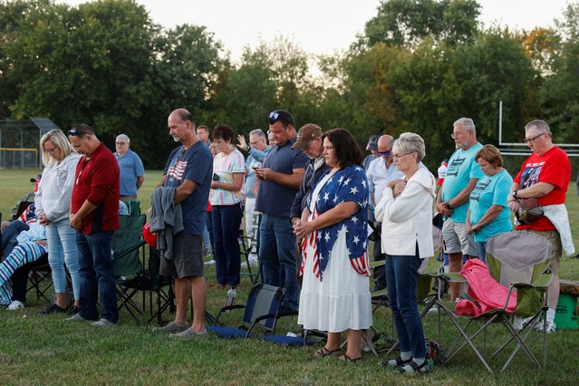 People attend a prayer vigil held against violence, following a shooting that took place at the Church of Jesus Christ of Latter-day Saints, in Burton, Michigan, U.S., September 28, 2025. (Photo by Rebecca Cook/Reuters)