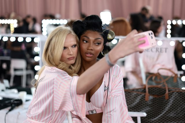 Alex Consani and Angel Reese prepare backstage at the Victoria's Secret Fashion Show 2025 on October 15, 2025 in New York City. (Photo by Dimitrios Kambouris/Getty Images for Victoria's Secret)