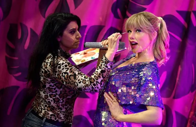 Studios artist Caryn Mitman works on a wax work representation of Taylor Swift ahead of the opening of a newly redesigned Music Festival zone of contemporary and historically famous singers and musicians, Madame Tussauds, in London, Britain on March 31, 2022. (Photo by Toby Melville/Reuters)