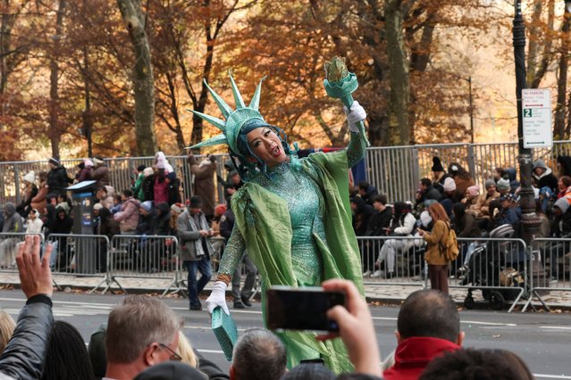 A woman dressed as the Statue of Liberty participates during the Macy's Thanksgiving Day Parade 2025, in New York City, U.S., November 27, 2025. (Photo by Brendan McDermid/Reuters)