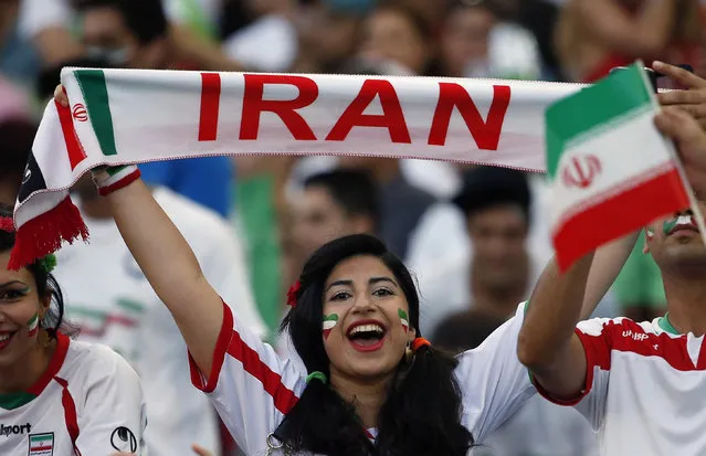 An Iran supporter cheers for her team before the Asian Cup Group C soccer match between Qatar and Iran at the Stadium Australia in Sydney January 15, 2015. (Photo by Jason Reed/Reuters)