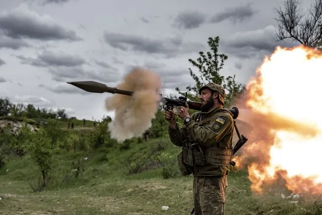 A soldier fires a rocket gun as Ukrainian soldiers in the Donetsk region, where the country's most intense clashes occur, attend intensive combat training by using both domestic and foreign weapons amid Russia-Ukraine war in Donetsk, Ukraine on May 08, 2023. Infantry is always prepared in a conflict where heavy weaponry like aircraft, helicopters, tanks and other heavy armored vehicles, artillery systems, and mortars are widely deployed on frontline. Combat readiness and experience training of the 57th Brigade of the Ukrainian army continues in Donetsk. (Photo by Muhammed Enes Yildirim/Anadolu Agency via Getty Images)