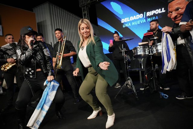Valeria Ripoll, running mate of Uruguay's centre-right presidential candidate Alvaro Delgado, dances during their closing campaign rally, in Las Piedras, Uruguay on October 22, 2024. (Photo by Mariana Greif/Reuters)